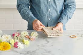 Prepare the flower for pressing by placing it between two sheets of absorbent paper. How To Press Flowers Better Homes Gardens