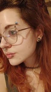 Got 3 new piercings for Christmas!! My nostrils and navel making my total  count 13 (I have 2 lobes just don't have my 2nd in)