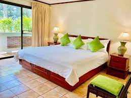 These individually decorated accommodations have separate sitting areas. Surin Bay Inn Surin Beach Thailand Booking Com