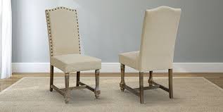These Beautiful Dining Chairs Feature Oatmeal Linen Upholstery And An Elegant Nailhead Trim Upholstered Chairs Upholstered Dining Chairs Chair