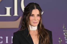 Sandra Bullock’s Lace-Trimmed Blazer Plunges All the Way Down to Her Ribcage