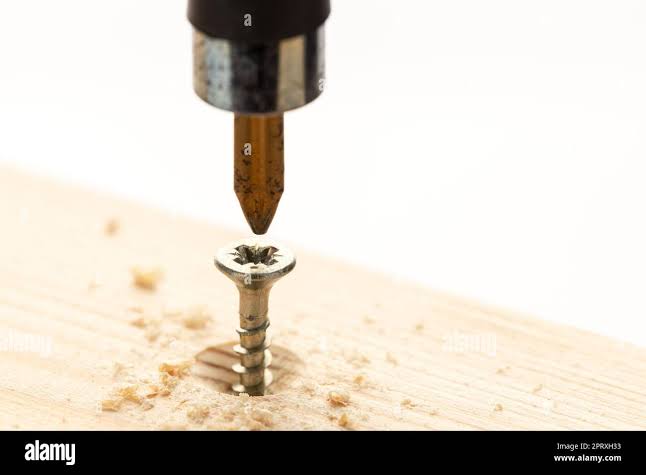 Screw screwed into wooden plank hi-res stock photography and images - Alamy