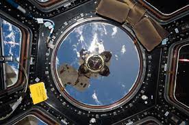 The End Effector Or Grappler At The End Of The Space Station S Canadarm 2 Robotic Arm Is Visible Out The Main Win Space Station Space Pictures Space Flight