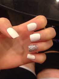 Acrylic nail designs can be created with a blend of matte black and shiny silver. White With Silver Glitter Acrylic Nails White And Silver Nails White Acrylic Nails Silver Acrylic Nails
