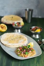 Spicy Tangy Juicy And Mouthwatering White Peas Topped With Chopped Tomatoes Onions Green Chili Coriander Leaves An Kulcha Recipe Recipes Quick Vegan Meals