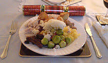 With a roast turkey, goose or chicken and trimmings. British Cuisine Wikipedia