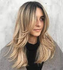 Create soft movement underneath these long bangs and cut layers throughout the length of the hair. 50 Cute Long Layered Haircuts With Bangs 2021