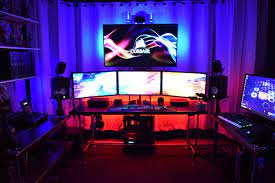 This Setup Has It All Three Monitors With Tv Above Xbox Playstation Mixer Studio Speakers With 5 1 Surround Sound Laptop Gaming Setup Setup Gaming Setup