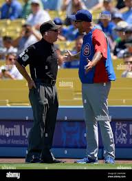 Chicago Cubs manager Dale Sveum, right, argues a call with first base  umpire Lance Barksdale during the first inning of their baseball game  against the Los Angeles Dodgers, Wednesday, Aug. 28, 2013,