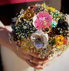 This bouquet is so stunning: Forever Meaningful Wedding Brooch Bouquets Equally Wed Modern Lgbtq Weddings Lgbtq Inclusive Wedding Pros