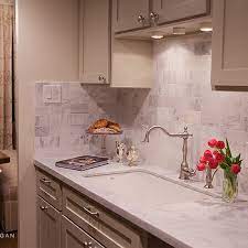 While ambient lighting is used to navigate throughout the kitchen, it often leaves shadows under cabinets, in areas that require more focus. Lighting Over Kitchen Sink Design Ideas