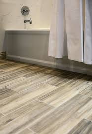 Faux Wood Ceramic Tile In The Bathroom Easy To Clean And Still Gets The Rich Look Of Wood Thetileshop Wood Tile Bathroom Floor Faux Wood Tiles Tile Floor