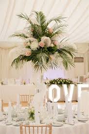 50 Green Tropical Leaves Wedding Ideas In 2020 Tall Wedding Centerpieces Wedding Flowers Wedding Centerpieces