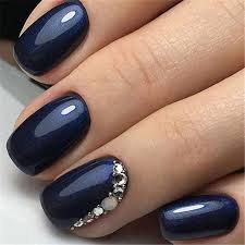 Nail art is always spectacular, and here the presence of the tulips, realistically highlighted against a blue green glittering background over neutral acrylic nails is nothing. 40 Trendy 2019 Dark Blue Nail Art Designs