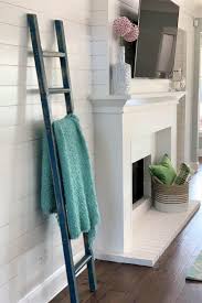 The blue and white palette, the shiplap walls, the casual vibe, and the use of seashells as accents are all hallmarks of this easy, breezy vibe. Adding A Shiplap Feature Wall To Living Room Thetarnishedjewelblog