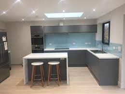 Howdens Clerkenwell In Matt Grey With Blue Glass Splashback Kitchen Ideas New House Modern Kitchen Design Kitchen Remodel