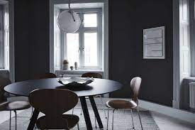 Our love of nordic style interiors will never end. Tour The Dark Serene And Homey Workspace Of A Swedish Financial Firm Nordic Design Tour A Dark Serene And Refined Office Space In Sweden Interior Design Styles Nordic Design Dining