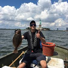 Happy Fourth of July! Academy fisheries biologist Colin Rohrback holds a  Summer Flounder collected from Upper Bay, N.J., just south of the Statue of  Liberty. This specimen was used for the Academy's