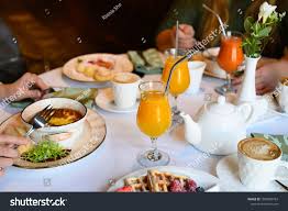 morning breakfast or brunch in the restaurant table with drinks and food selective focus sponsored affiliate brunch rest brunch restaurants brunch food