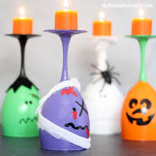Centerpieces with wine glasses and candles make stunning table decorations. Halloween Wine Glass Candles Fun Diy Halloween Decoration