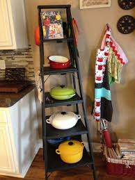 Le Creuset Pans Displayed On Repurposed Latter Great Storage Solution Easy Access Farmhouse Kitchen Decor Kitchen Tiles Design Kitchen Craft Cabinets