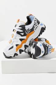 Skechers presents their new one piece collection, a limited edition collection of sneakers featured with colorways and graphics directly inspired by breathable mesh lined interior. Skechers D Lites One Piece Orange Trainers Womens Sneakers Trending Sneakers Skechers D Lites
