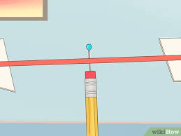 Weld a short piece of hollow driveline, with the solid spline shaft part pointed upward, to the wheel center. How To Make A Wind Vane With Pictures Wikihow