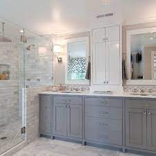 Beige shaker vanity paired with white countertop, frameless mirror, and black sconces. Top 10 Double Bathroom Vanity Design Ideas White Bathroom Designs Bathroom Remodel Master Gray And White Bathroom