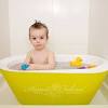 Use one hand to support baby's head, then slowly lower. 1