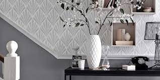 Choose a wallpaper that has a simple print on a white background, such as soft polka dots or a textured pattern. 8 Bold Hallway Decorating Ideas