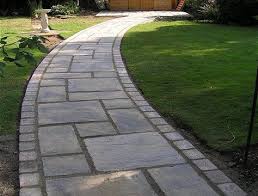 For a simple modern path, lay two sizes of circular concrete pavers between your driveway and your front door. Garden Path Ideas
