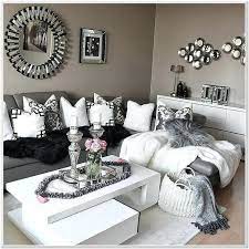 Add white slipcovers to furniture in a silver living room, then black and white artwork and a big furry silver rug for a more relaxed vibe. White And Silver Living Room Designs