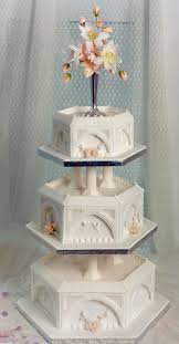 A Royal Iced Hexagonal Wedding Cake With Run Out Pieces Giving An Architectural Look Creative Wedding Cakes English Wedding Cakes Amazing Wedding Cakes