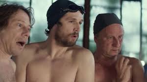 The swim cap black Marcus (Benoît Poelvoorde) in The big bath