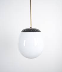 For a rugged rustic fixture option, you cannot go wrong with spanish style pendant lighting. Stilnovo Large Ball Pendant Lamp Opal Glass Circa 1950