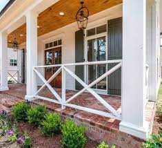 Most new front porch railings or remodeling must comply with local code requirements. From Wood Deck Wrought Iron Lattice Panels And Steel Cable To Glass Panels Knee Walls And More We Hav Porch Design House Exterior Farmhouse Front Porches