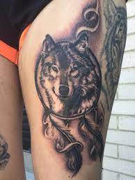Combining dreamcatchers with wolves in a tattoo certainly, give the designs a more profound meaning. Wolf Dreamcatcher Thigh Piece By Lou Shaw For More Of Lous Work Follow His Facebook And Instagram Lou Wolf Dreamcatcher Wolf Dreamcatcher Tattoo Wolf Tattoos