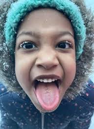 My grandbaby catching snowflakes
