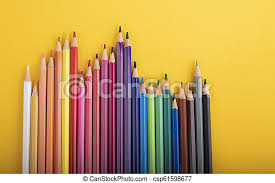 Essential paint tools & accessories. Many Pencils Of Different Colors In A Row On Yellow Cardboard Canstock
