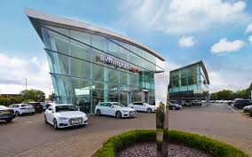 Through to the opposite side of the showroom is the used car area. Audi Dealership Bsb Real Estate