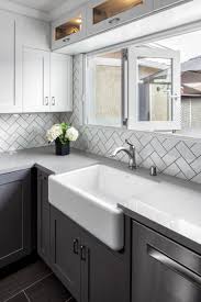 Remodeled Kitchen Complete With White Subway Tile Backsplash In Herringbone Pattern Gray And White Kitchen White Kitchen Design Backsplash For White Cabinets