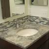 Cultured marble, granite and solid surface resin are materials options available in bathroom vanity backsplashes. 1