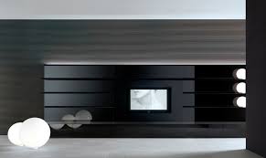 The deep teal wall from the dining room continues through to the bedroom, and the glass walls allow the light from the windows to travel throughout the apartment. Contemporary Tv Wall Unit Abacus Living Rimadesio Glass