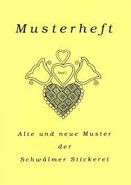 Kissen mit den typischen motiven der schwälmer stickerei wie tulpe, herz, sonne usw. Bucher Weissstickerei Museum Der Schwalm