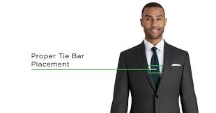 Put the wide end of the tie across the narrow end at the neck. How To Wear A Tie Clip Tie Bar Placement And More Black Lapel