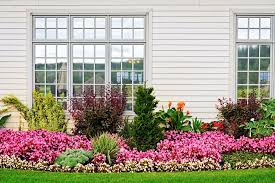 Gorgeous garden and front yard landscaping ideas that help highlight the beauty and architectural in this example, evergreen bushes are interspersed with spring and summer flowers as well as annual. Picking Flowers And Trees Shrubs And Bushes Choosing The Right Plants For Landscaping New England Condominium The Condo Hoa Co Op Monthly