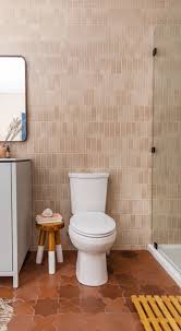 Floor To Ceiling Tile In This Beautiful Basement Bath Featuring 2x6 Tiles In Sand Dune And Large S Brown Tile Bathroom Fireclay Tile Brown Tile Floor Bathroom