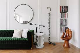 A creamy white modular sofa and a matching rug keep the centre of the space light, whilst black steel framed windows darkly white and green living spaces that feel crisp and fresh. Black White Design Gives This Home An Invigorating Spin