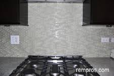 glass mosaic vs marble tiles kitchen