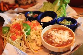 Let the fish rest a few minutes before using a fork to flake it into pieces. Islands Restaurant Fish Tacos
